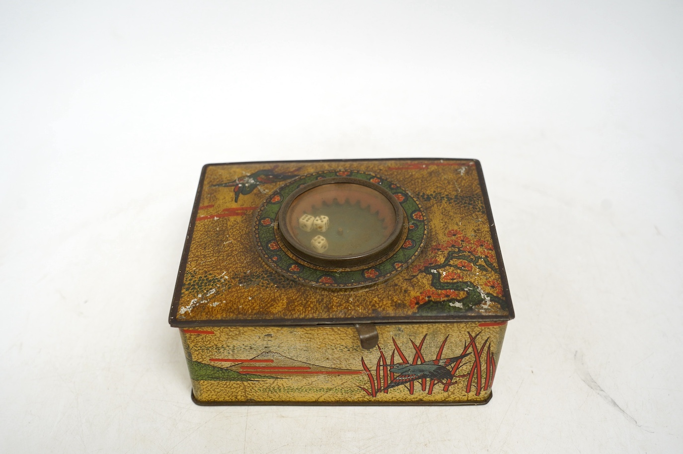 An early 20th century Carrs novelty 'dice game' biscuit tin, a Don Confectionery 'chessboard' tin and a Wright & Son Ltd inkstand tin, largest 33cm wide. Condition - fair